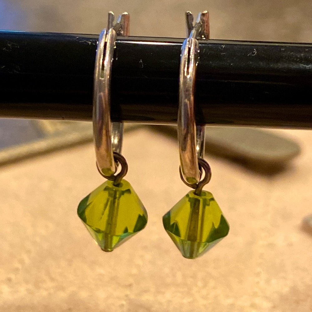 Silver hoop earrings with green drop bead